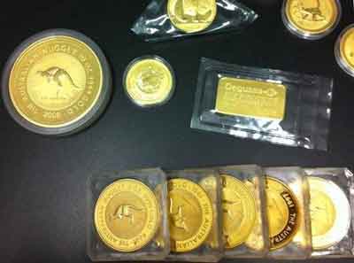 Lingote y monedas de oro